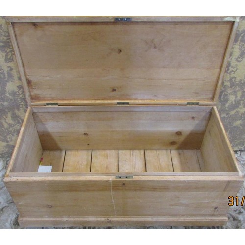 1199 - A stripped pine blanket chest with inset carrying handles raised on block feet 110cm w x 49cm h x 54... 