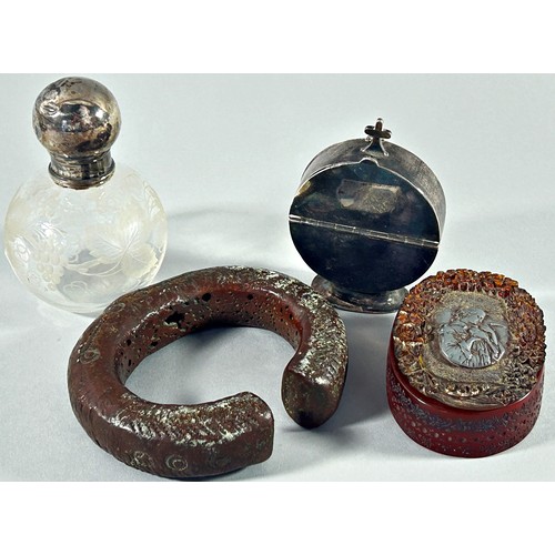 263 - An ecclesiastical silver metal wafer dispenser, a heavy bronze bangle and intricately carved amber B... 