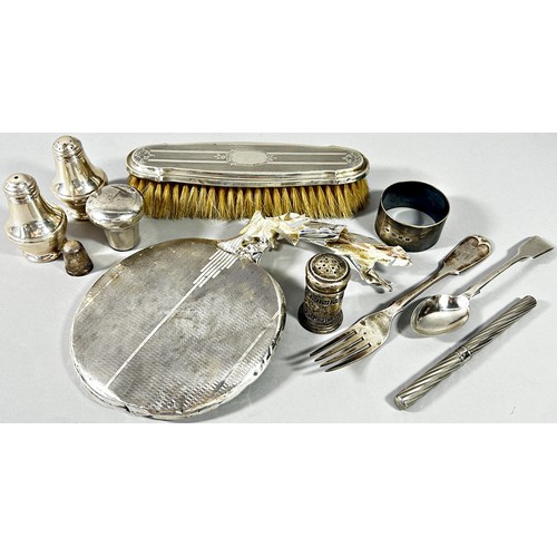 268 - A variety of silver items including a scalloped shaped dish, a sugar bowl, condiments, clothes brush... 