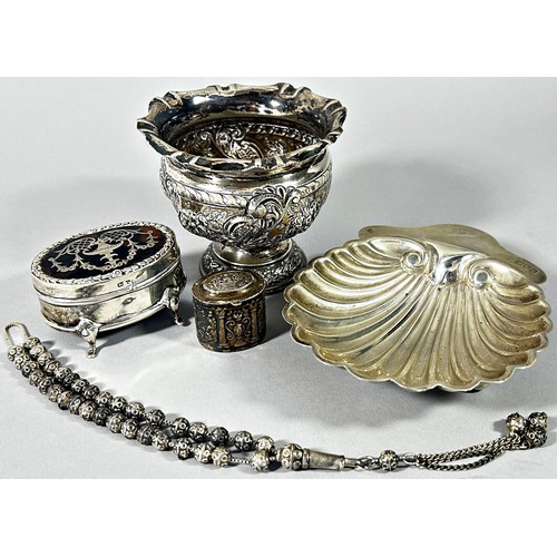 268 - A variety of silver items including a scalloped shaped dish, a sugar bowl, condiments, clothes brush... 