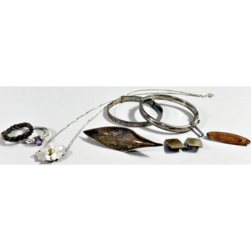 274 - A selection of silver flatware, ladle, sugar tongs, a silver babies bangle, 999. silver ingot, and d... 