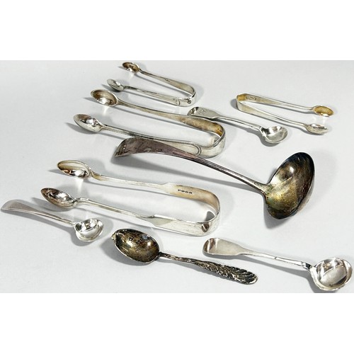 274 - A selection of silver flatware, ladle, sugar tongs, a silver babies bangle, 999. silver ingot, and d... 