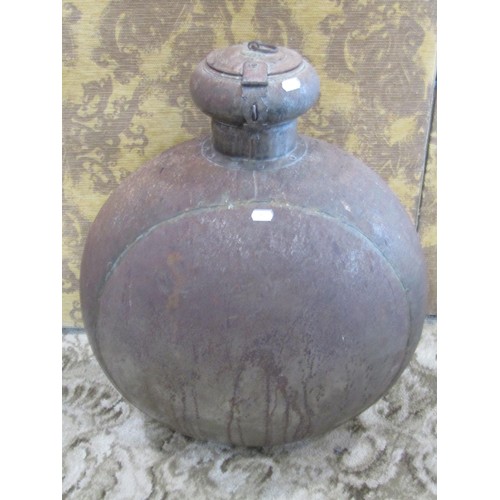 1247 - A large Indian circular metal work ‘moon’ flask with hinged cover, 70cm high