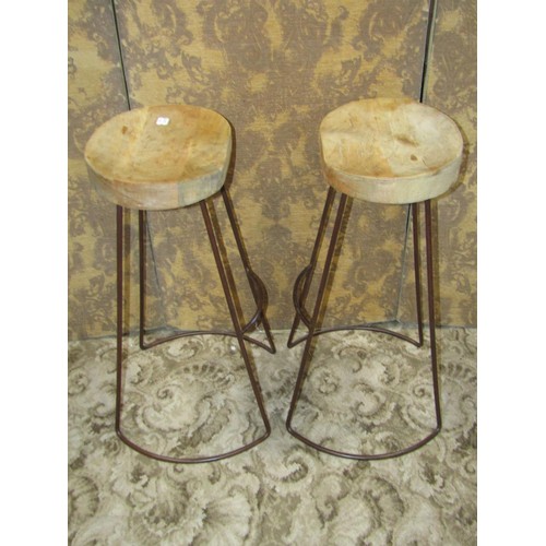 1251 - A pair of vintage style bar stools with metal supports and saddle shaped timber seats, 75cm high