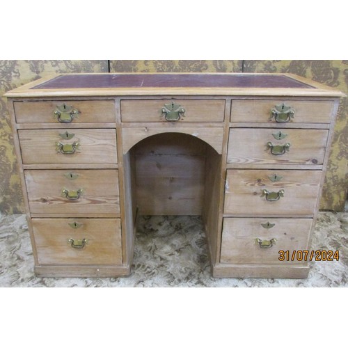 1208 - A 19th century pine knee hole desk with leather inset top, central drawer flanked by two towers of f... 