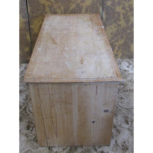 1212 - A low stripped pine chest with two long drawers 106cm w x 53cm h x 50cm d.