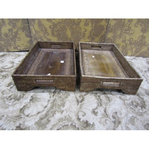 1205 - Three similar Butler’s woven cane trays / occasional tables, all with folding stands, with labels Ta... 