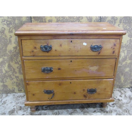 1213 - An old pine chest with three graduated long drawers raised on turned supports, 85cm w x 81cm h x 41c... 