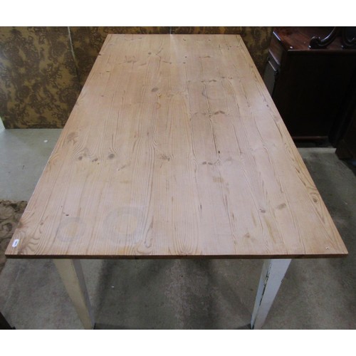 1198 - A pine kitchen table with stripped plank top and painted base raised on square tapered supports, 78c... 