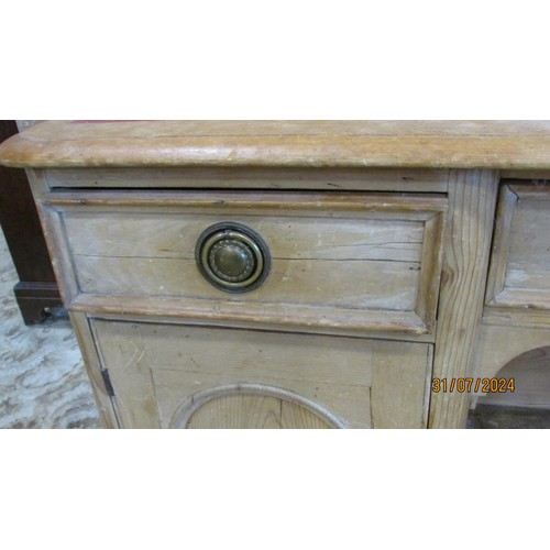 1215 - A 19th century pine kneehole writing desk with leather top with a row of three drawers with cupboard... 