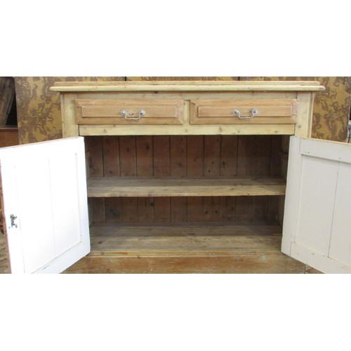 1222 - An Edwardian stripped pine side cupboard with two drawers over a pair of panelled doors, 131cm w x 1... 