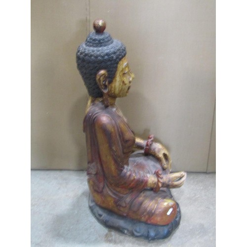 1265 - A large painted carved hardwood figure of a seated Buddha