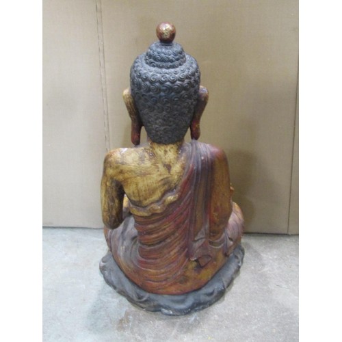 1265 - A large painted carved hardwood figure of a seated Buddha