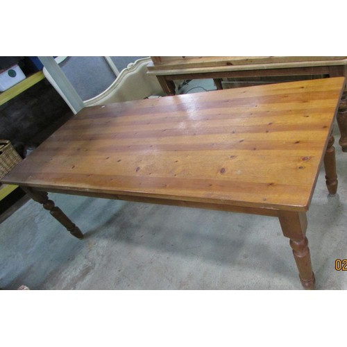 1232 - A large contemporary pine kitchen table on for turned supports, 142cm x 93cm.