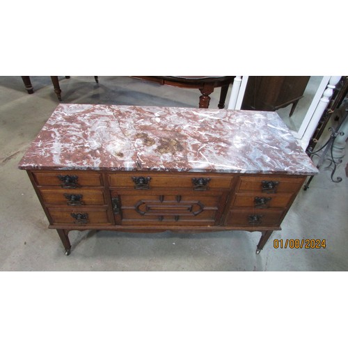 1269 - An Art Nouveau washstand in oak with enclosed front beneath a marble top (top af)