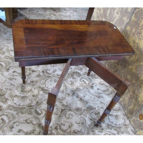 1279 - A 19th century mahogany D end foldover top card table on turned supports