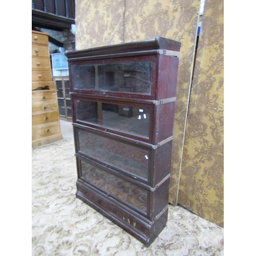 1283 - An Edwardian mahogany four tier Globe Wernicke bookcase, raised on base section, each tier with badg... 