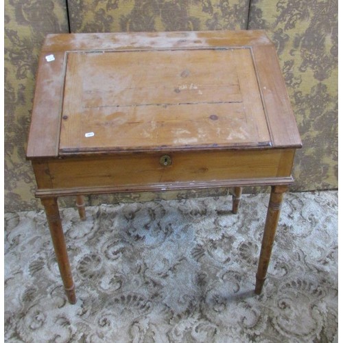 1286 - A 19th century pine clerk’s desk, with a hinged cover enclosing a divisional interior, with brass es... 