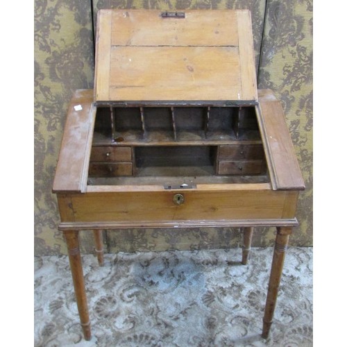 1286 - A 19th century pine clerk’s desk, with a hinged cover enclosing a divisional interior, with brass es... 