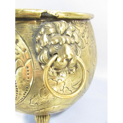 545 - A large continental brass jardiniere/coal pail of cauldron form, raised on three lion paw supports w... 