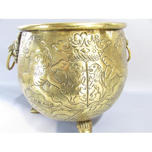 545 - A large continental brass jardiniere/coal pail of cauldron form, raised on three lion paw supports w... 