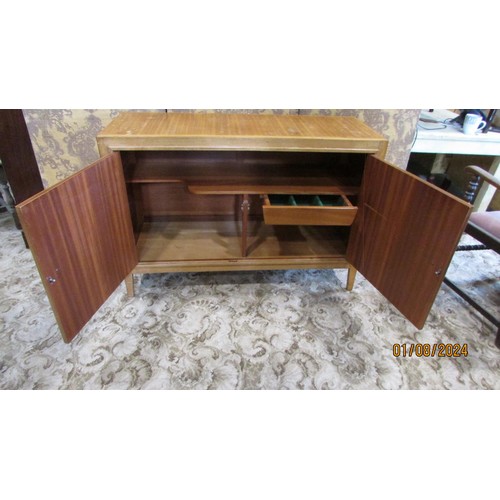 1290 - A mid 20th century retro Gordon Russell ‘Helix walnut sideboard, with incised hinged panelled doors ... 