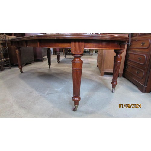 1292 - A Victorian mahogany extending dining table, with three additional leaves and winder, 74cm high, 233... 