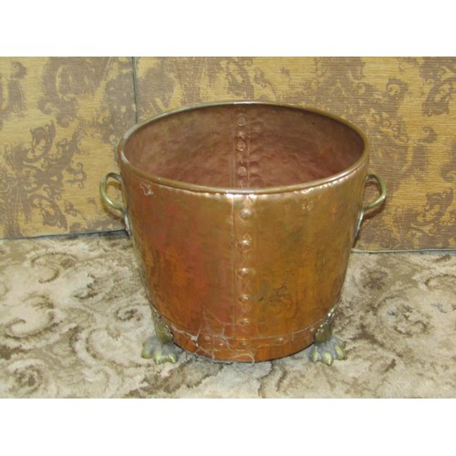 1296 - A twin-handed riveted copper coal pale, 32cm high, 34cm diameter, together with a large Eastern copp... 