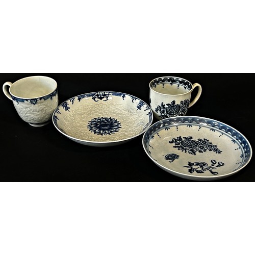 121 - An 18th century Worcester chrysanthemum cup and saucer, each piece with trailing floral embossed det... 