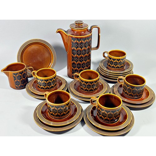 135 - A collection of Hornsea Airloom pattern tableware including cups and saucers and a number of lidded ... 