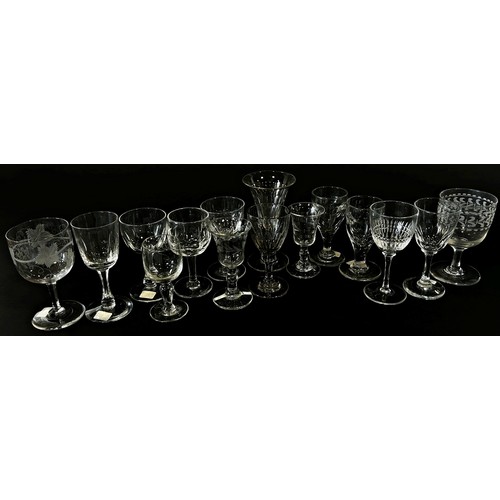 206 - A good collection of 19th and 20th century 28 wine glasses and toasting glasses, some of bell shape,... 