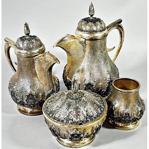 269 - An Indonesian silver Arabic style tea and coffee service with two pots, sugar bowl, a caddy bowl, si... 