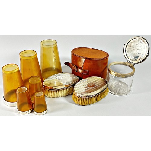 271 - A mixed selection of hairbrushes and hand mirrors with silver banding, together with a glass jar wit... 