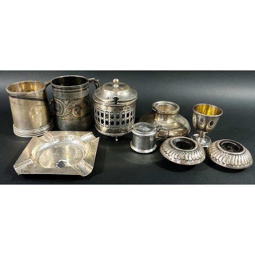 273 - A large mixed group of silver to include eight napkin rings, a silver mustard cup, a silver tankard,... 