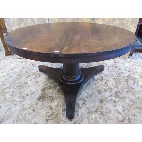 1302 - A 19th century rosewood tilt top breakfast table, on turned pillar support and trefoil platform base... 