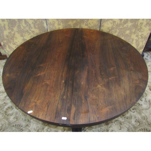 1302 - A 19th century rosewood tilt top breakfast table, on turned pillar support and trefoil platform base... 