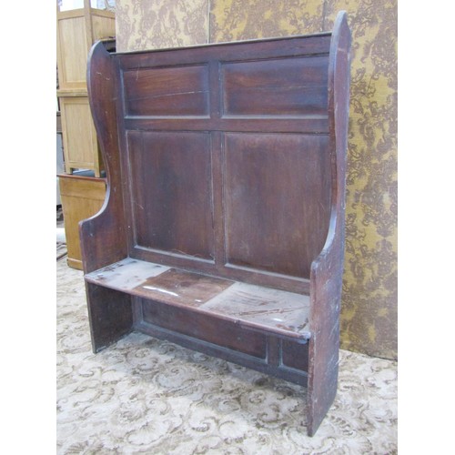 1304 - A 19th century mahogany pub/tavern settle with panelled back and shaped wing sides, 158 cm high, 124... 