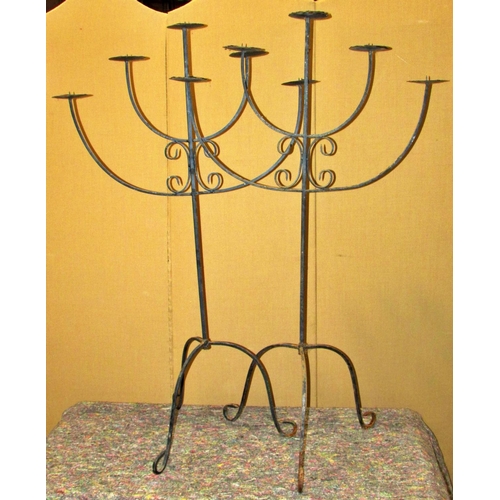 1155 - A pair of freestanding five divisional candle stands, 135cm high, together with an Eastern brass Ben... 