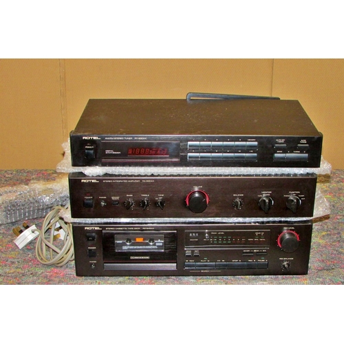 1163 - A vintage stereo equipment to include a Linn Basik turntable, Rotel stereo tuner RT-930AX, stereo in... 