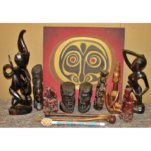 1165 - A large collection of decorative 20th century African export souvenir carvings to include masks, fig... 