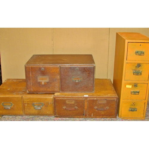 1175 - A group of early 20th century oak and other banks of filing drawers (4)