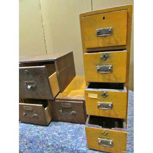 1175 - A group of early 20th century oak and other banks of filing drawers (4)