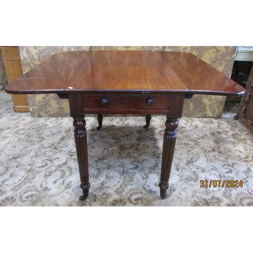 1306 - A Victorian mahogany drop leaf table, raised on fluted legs and brass casters, 75cm high, 86 x 105cm... 