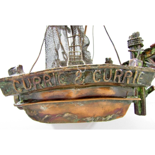 510 - A hand made model copper fishing boat attached to a quay, named Currie & Currie, 45cm long