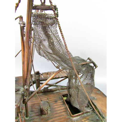 510 - A hand made model copper fishing boat attached to a quay, named Currie & Currie, 45cm long