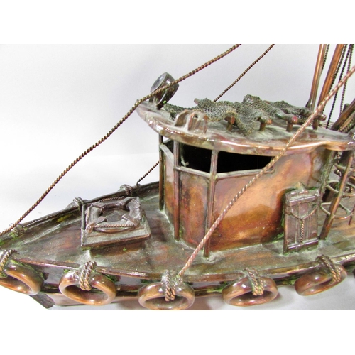 510 - A hand made model copper fishing boat attached to a quay, named Currie & Currie, 45cm long