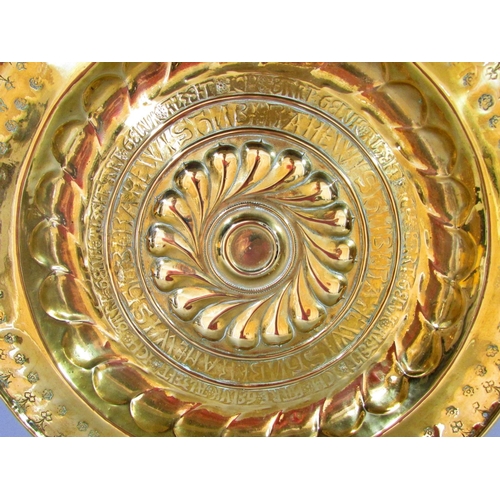 517 - A 19th century German brass alms dish, embossed and engraved, 41cm diameter