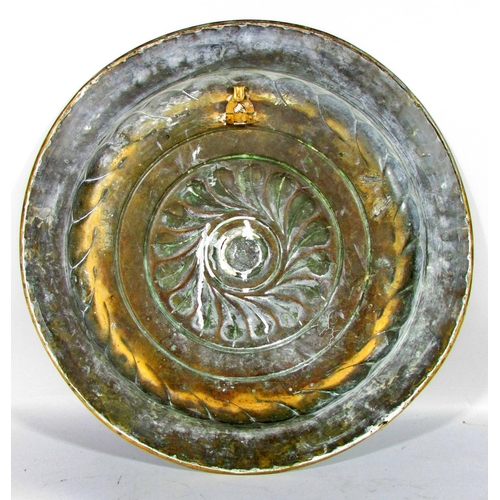 517 - A 19th century German brass alms dish, embossed and engraved, 41cm diameter