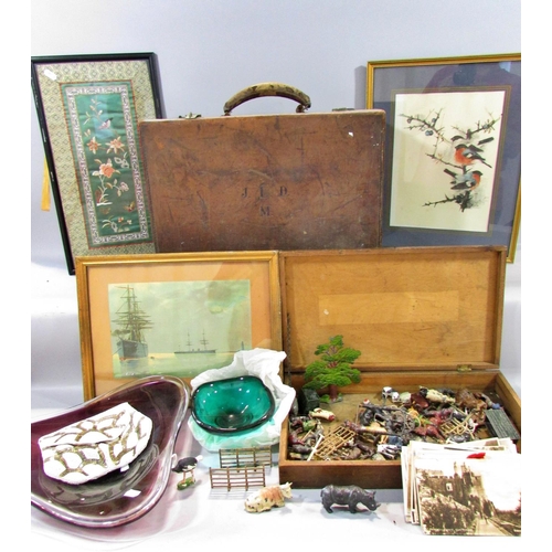 519 - A leather bound trunk / suitcase containing miscellaneous effects to include a framed Chinese embroi... 