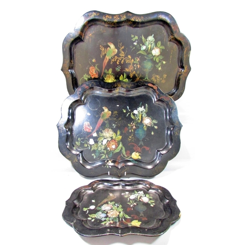 529 - Three 19th century graduated papier-mâché trays  with hand painted parrots amongst flowers decoratio... 